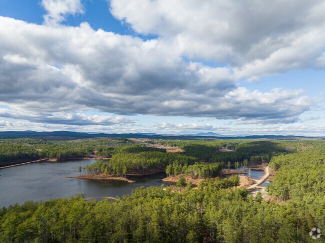 Clough State Park in Dunbarton offers outdoor adventures with trails, picnic spots & lake views.