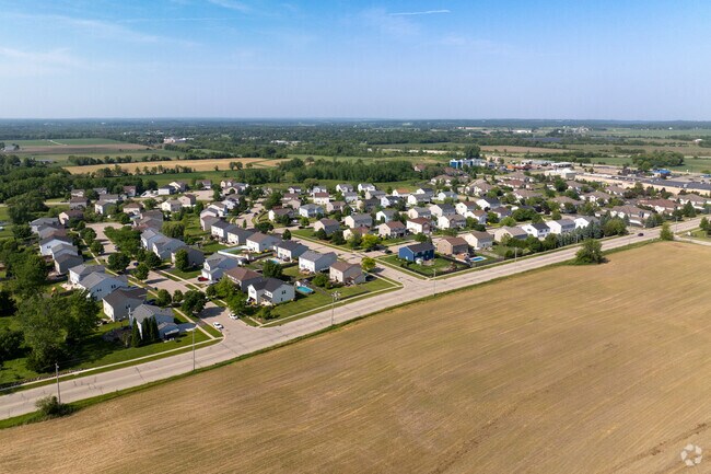 Curving suburban streets meet golden farmland in quiet and scenic Elkhorn.