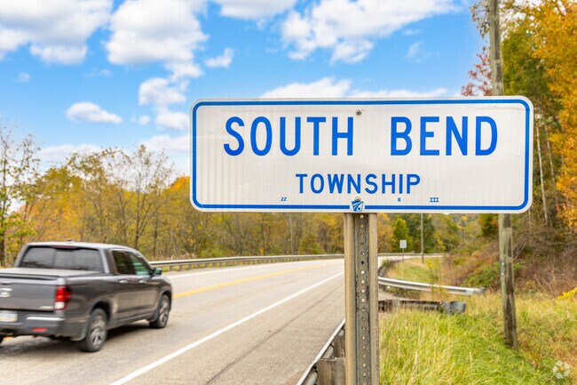 A truck drives into the rural farmlands of South Bend Township.