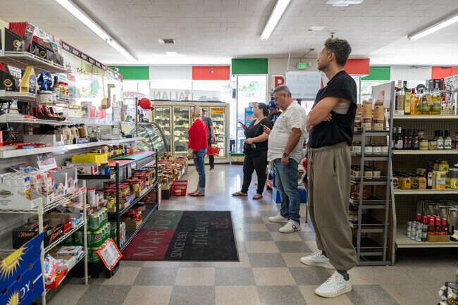 Regulars line up for Mario's famous Italian subs, stacked high with freshly sliced meats and homemade dressing.