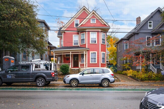 Bright colored Victorian homes add character to the tree lined streets of Porter Square.