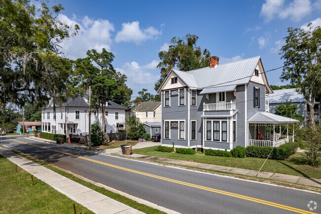 A row of historic Victorian two story homes in SE Ocala near the Historic District.
