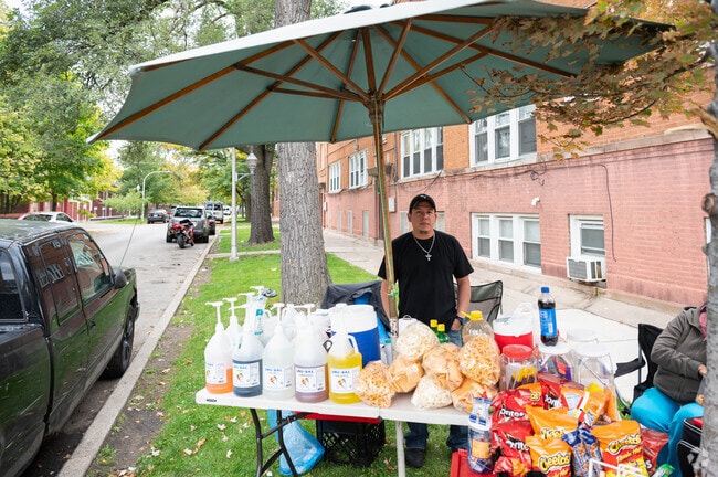 A neighborhood vendor sells delicious snack items to residents in Chicago Lawn.