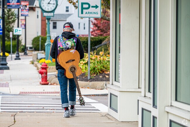 In Westville, a local musician scours the main drag looking forward to his next gig.