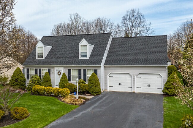 A charming Cape Cod home with dormer windows in Weigelstown.