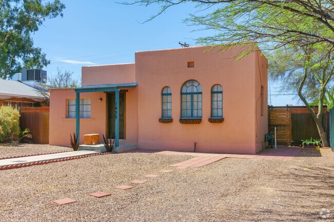 Arched windows display early 20th century architecture to Barrio San Antonio.
