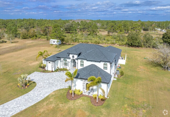 A large estate in Wedgefield has plenty of yard space along the Space Coast.