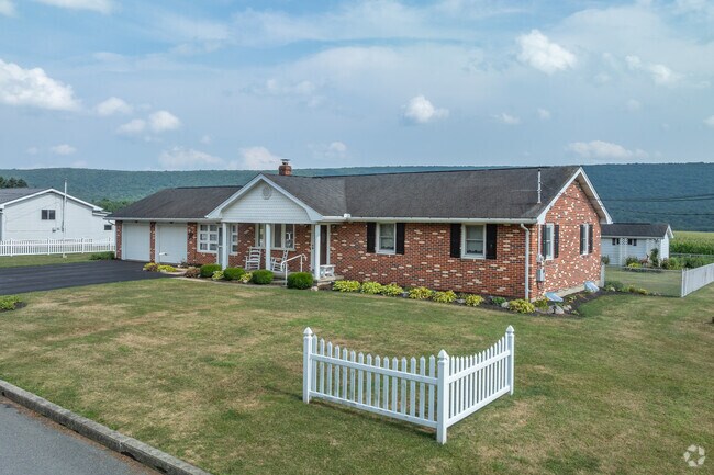 Ranch houses on larger lots of land with attached garages can be found in Muir.