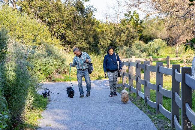 Augustus Hawkins Natural Park features a nice walking path surrounding a lake with wildlife.