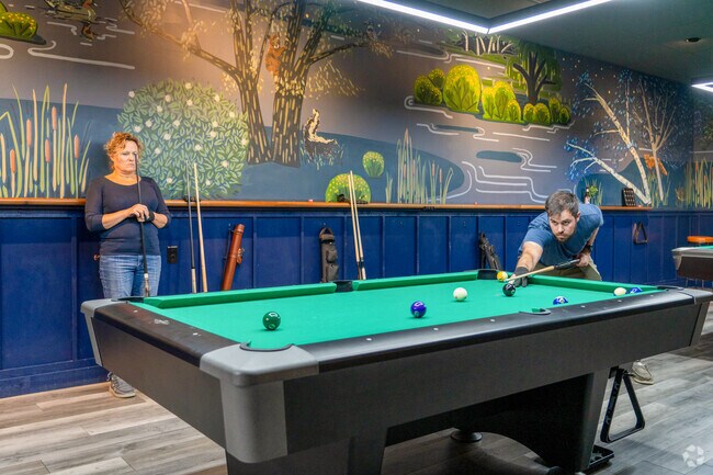 People play pool at league night at Tally, a bar about ten minutes from South Barre.