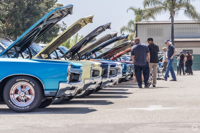 A long row of muscle cars brought Fullerton families out to the Airport Car Show.