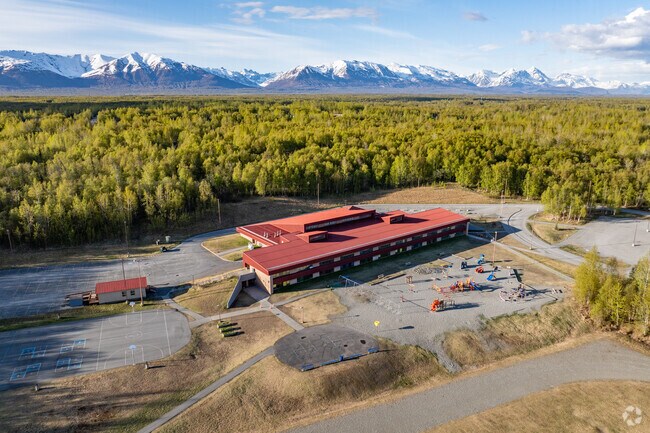 Finger Lake Elementary School is surrounded by forest and homes for a peaceful educational environment.