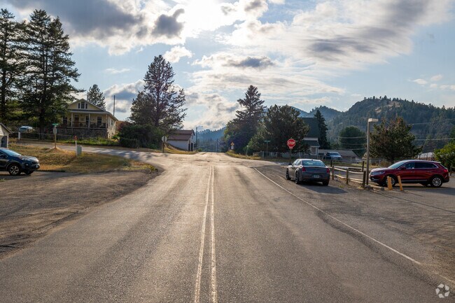The road entering Clancy’s town center welcomes you with picturesque mountain views.
