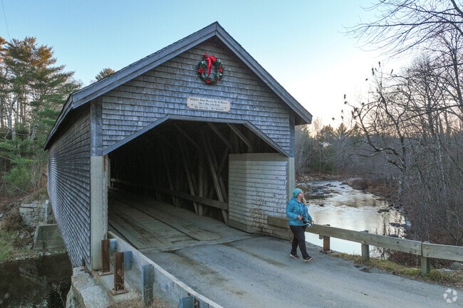 The Robyville Covered Bridge near Levant, Maine is a charming 19th-century wooden span, celebrated for its weathered timbers and classic New England covered-bridge character.