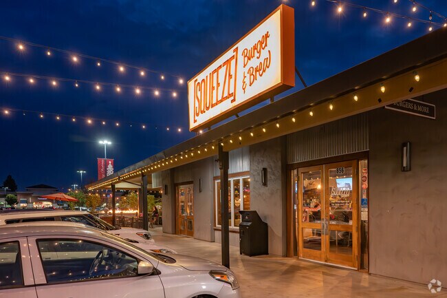 The night lights welcome Lincoln Village residents at Squeeze Burger.