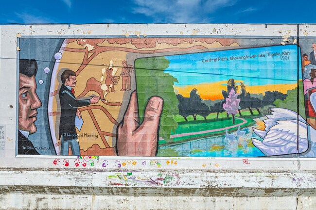 The Great Mural Wall of Topeka bursts with color in Chesney Park honoring the city's past.