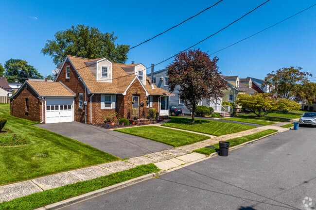 Quiet neighborhoods filled with grass and trees can be found around South Paterson.