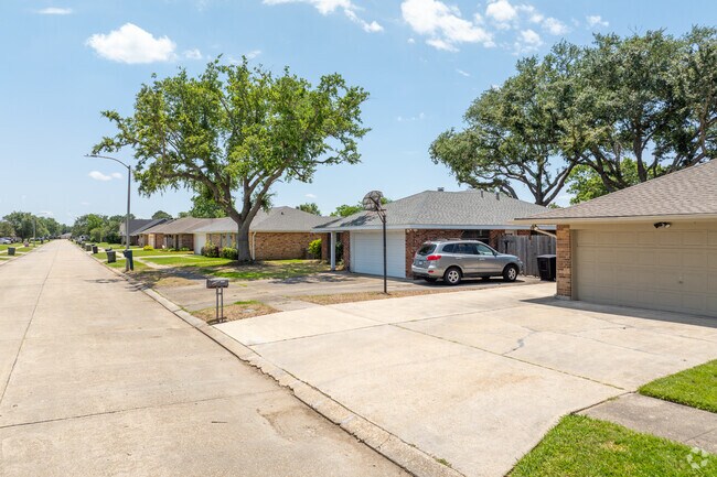 Summerfield Place is neighborly with large driveways and manicured lawns.