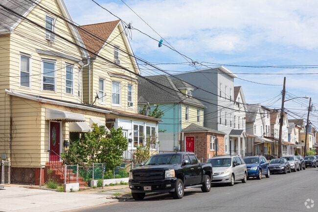 In Elizabethport, a row of eclectic homes stands proud, mirroring the neighborhood's rich diversity.