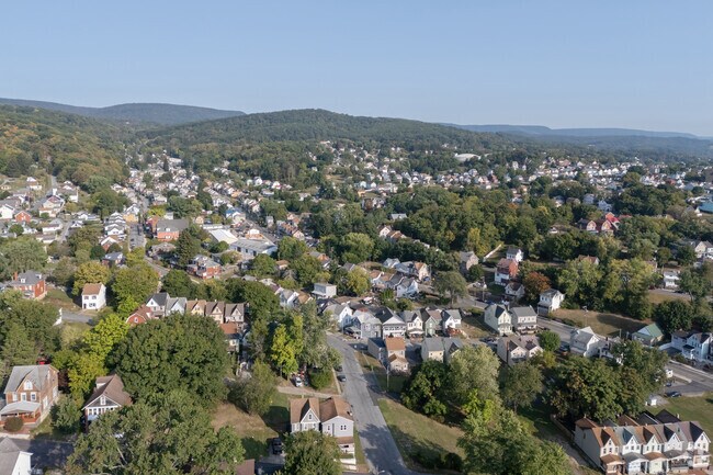 Mountains loom over the East Juniata neighborhood with an undulating landscape below.