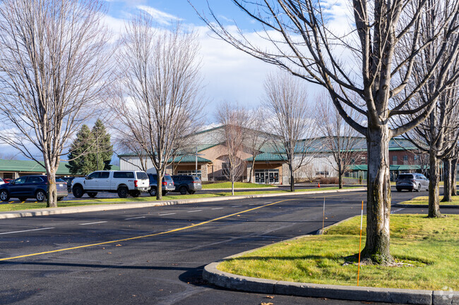Genesis Preparatory Academy sits next to a thrift store.
