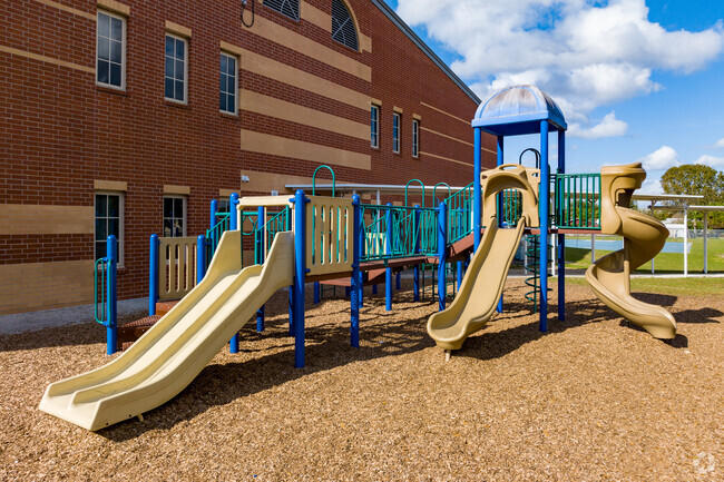 The large colorful playground provides students with ample space to have fun during recess.
