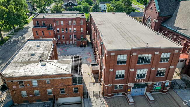 Over view of the front showing the playground for the school in the middle.