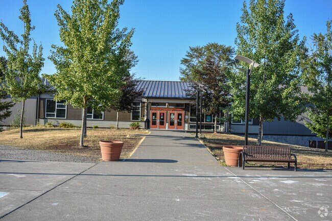 A view of the tree-lined entrance to Lakota High School in Federal Way, WA.