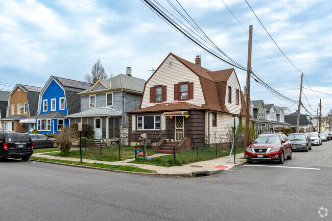 Dutch Colonial homes along Court Avenue seen with on-street parking