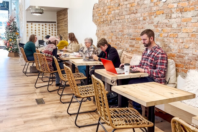 Filament Coffee and Tea in Cheeks is a popular spot where many residents enjoy working at the spacious indoor tables, blending productivity with a cozy café atmosphere.