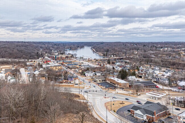 An aerial view of Downtown Algonquin highlights the Fox River & the area's picturesque setting.