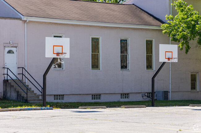 St. Boniface School is a Private Elementary School that has a small area to play basketball.