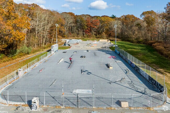 Kickflip over the funbox at the skatepark at Old Mountain Field in South Kingstown.