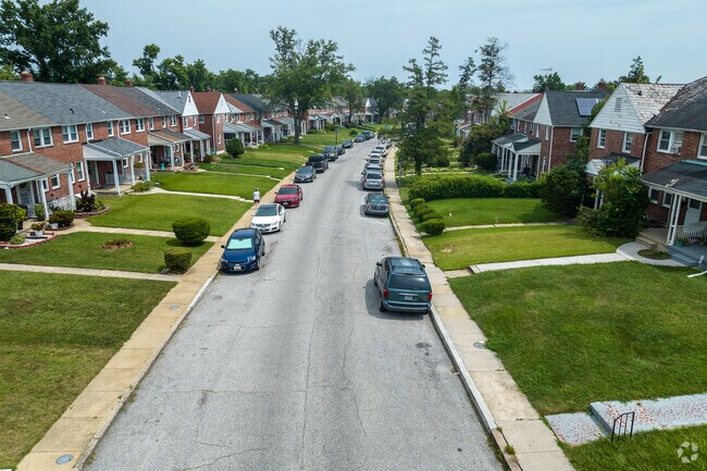 Two-story brick rowhomes line a quiet street in New Northwood.