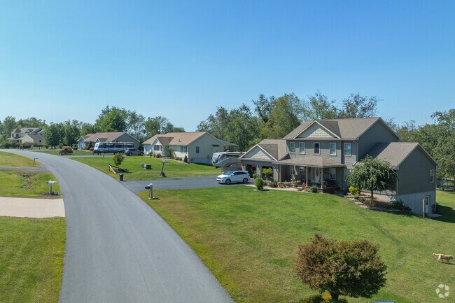Contemporary homes in Wolf Township sit on large lots, with wide neighborhood roads.