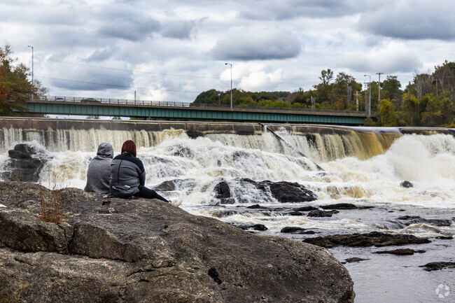 Enjoy a peaceful moment by the falls in Livermore Falls.