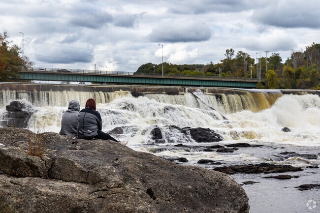 Enjoy a peaceful moment by the falls in Livermore Falls.
