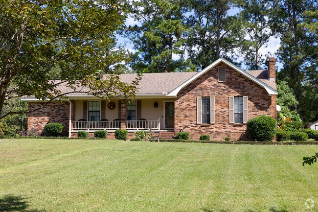 Classic front porch ranch home with large front yard in The Highlands.