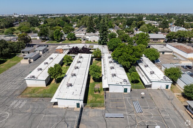 Lush green trees scatter along the Yolo High School campus.