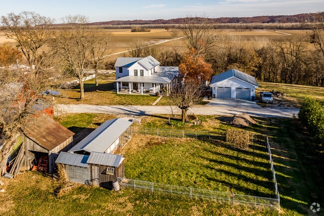 Old farmhouses are commonly found tucked into the hills of Defiance, MO.