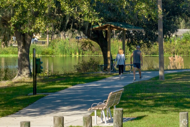 Enjoy the paved walking trail shaded by lush Oak trees at Dover District Park.