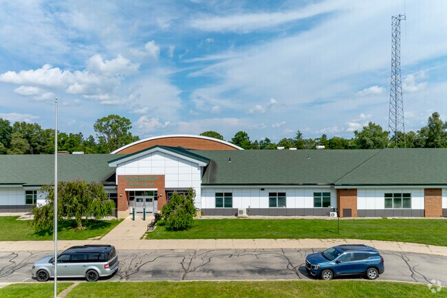 A looping drive brings parents to the entrance of Napoleon High School for drop-offs.