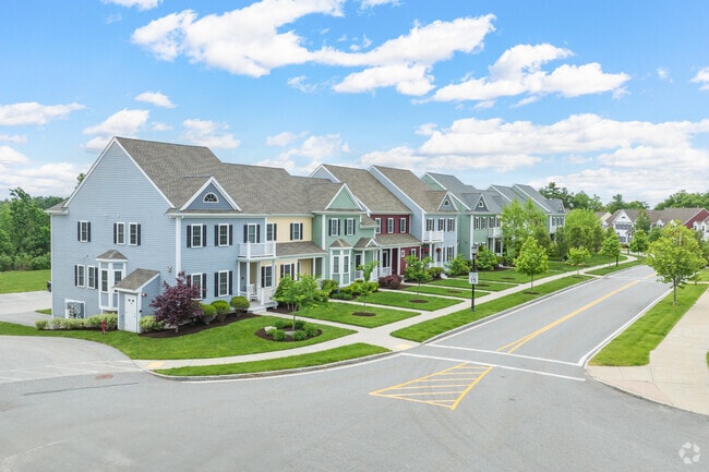 A vibrant row of colorful condos bringing charm and character to the neighborhood.