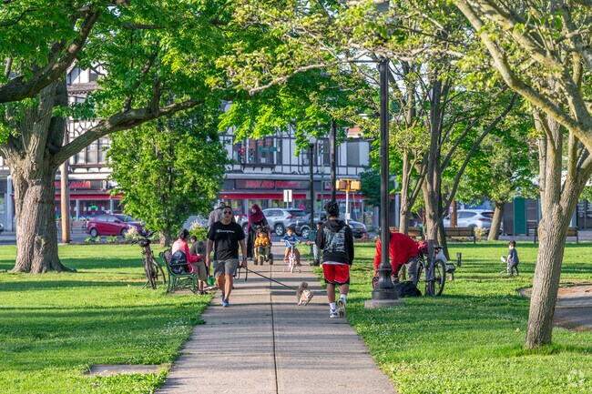 Residents enjoy a summer day at the Green in downtown West Haven Center.
