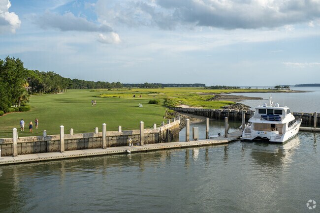 Families gathering the green space to watch the sunset and take pictures in Sea Pines.