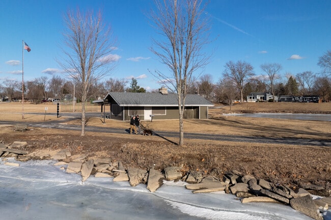 Loves Park locals go for a walk along the Rock River in Martin Park.