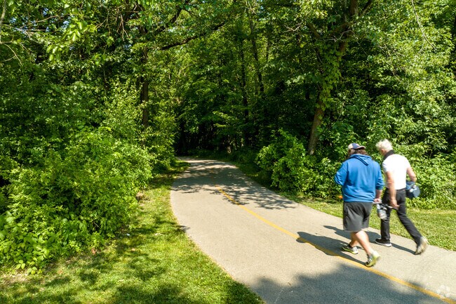 Residents of Elk Grove Village West taking a walk in Busse Woods.