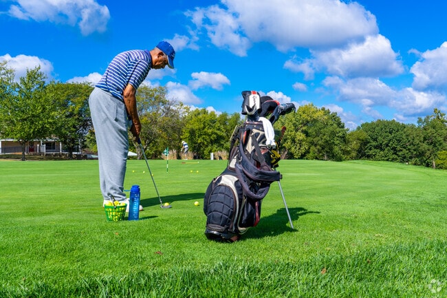 Practice your swing at the Eagle Springs Golf Course near Hathaway Manor.