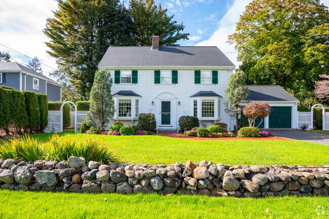 This Grove Street home is complimented by its forest green shutters and two bay windows.