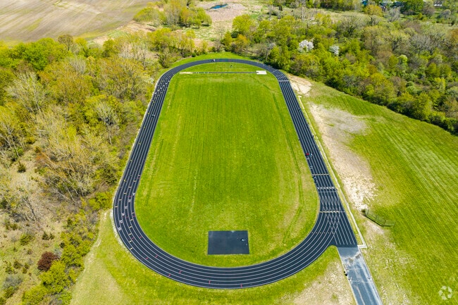 Sauk Village kids run track out in fields of Rickover Jr High.